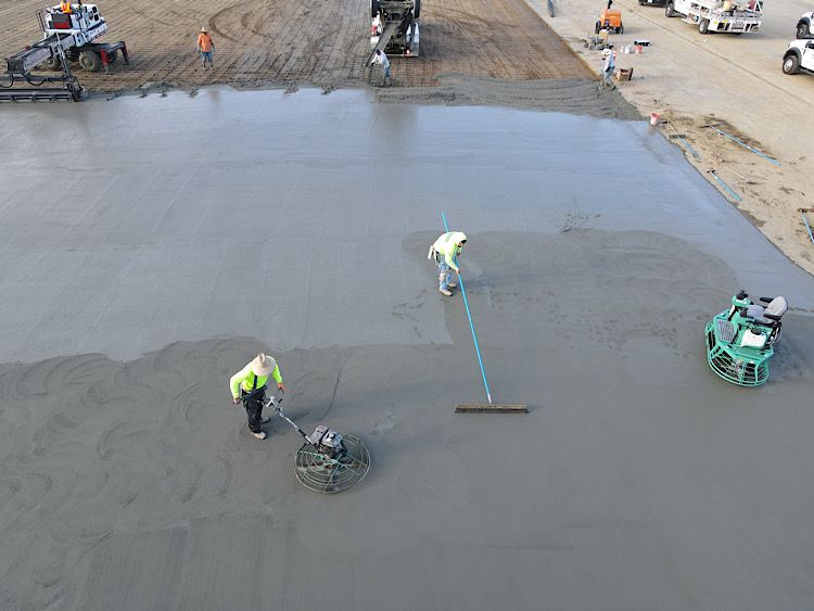 Remove and replace 4" of concrete for a parking lot at a commercial building.