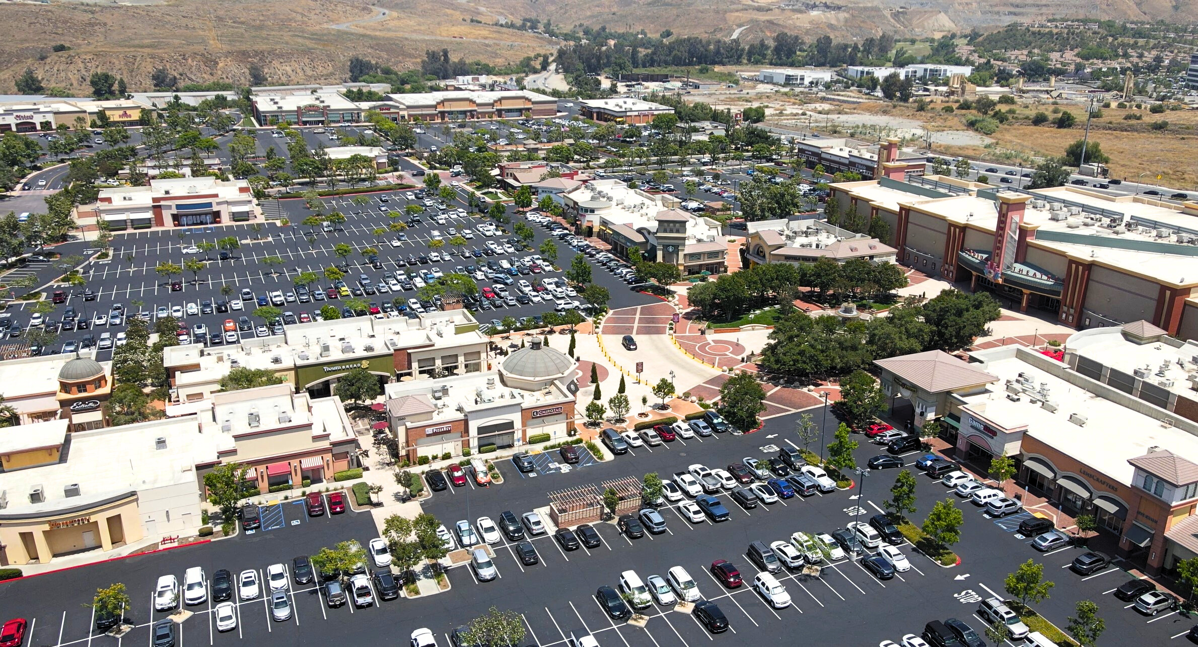 Asphalt sealcoat and restripe shopping center.
